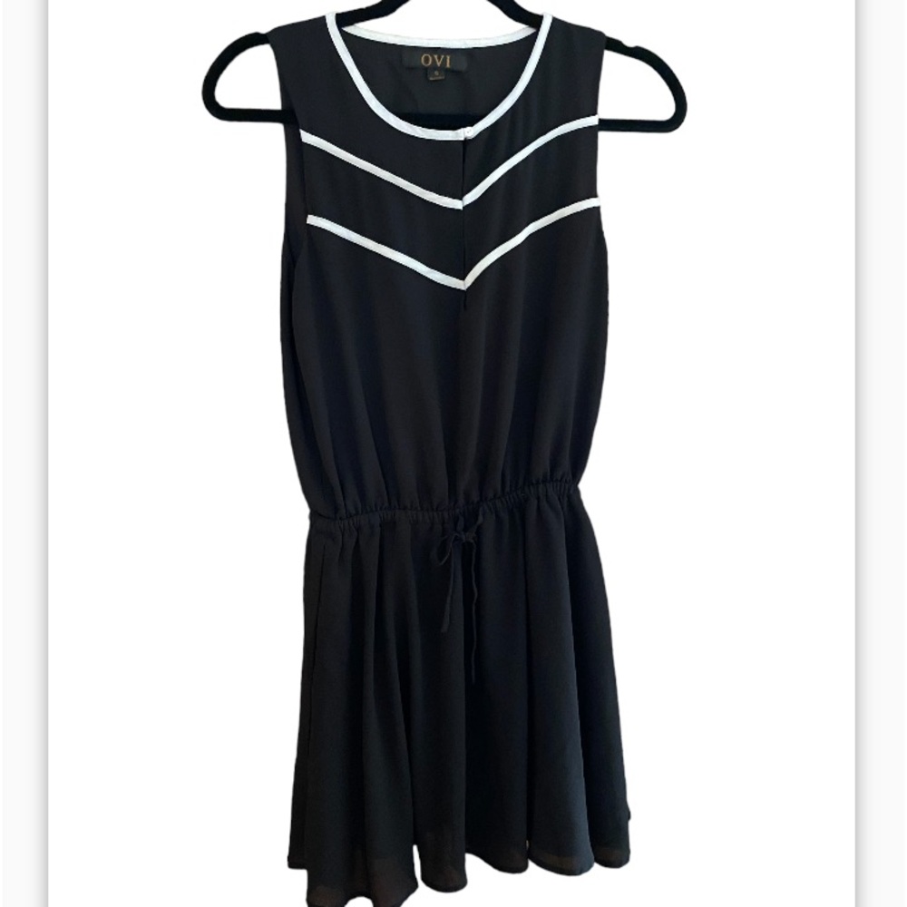OVI sleeveless mini dress. Deep V-neck size small.